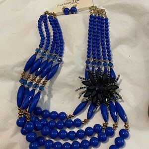 Blue Beaded Necklace with Black Floral Accent